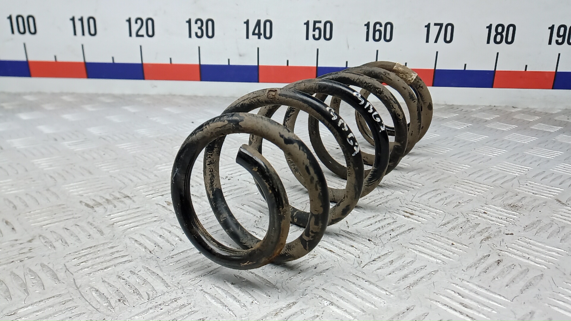 Пружина задняя