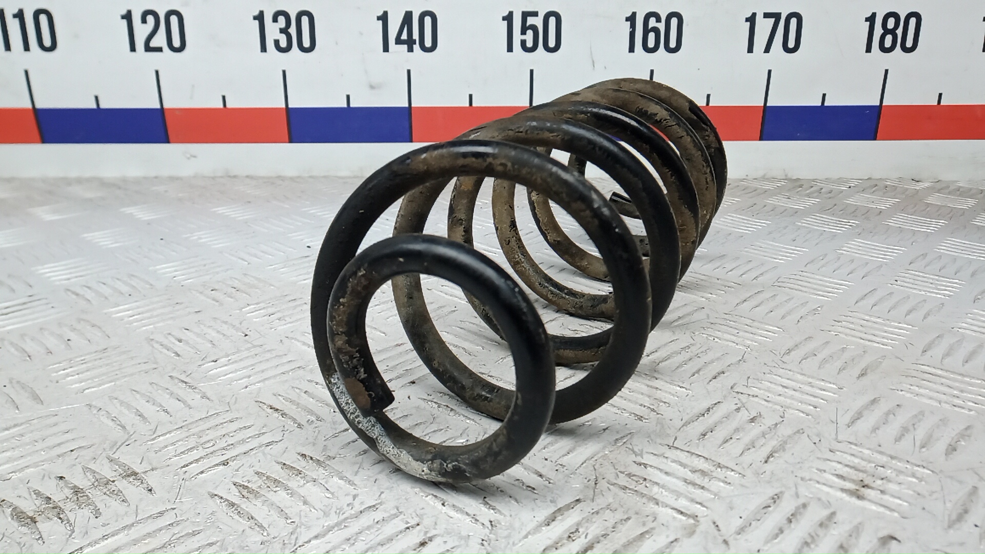 Пружина задняя