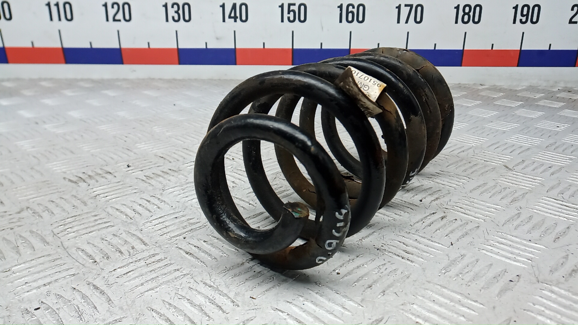 Пружина задняя