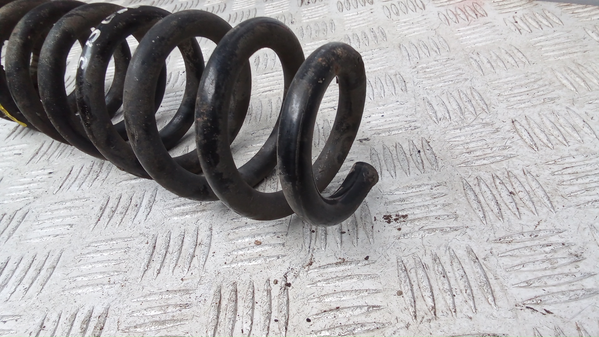 Пружина задняя