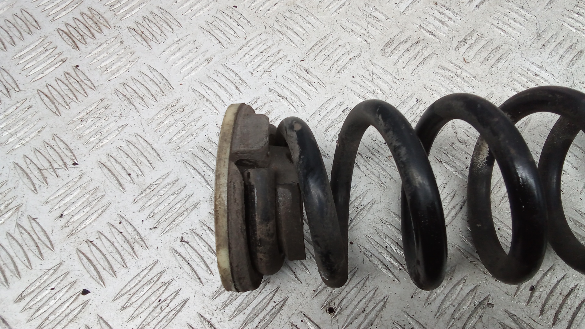 Пружина задняя