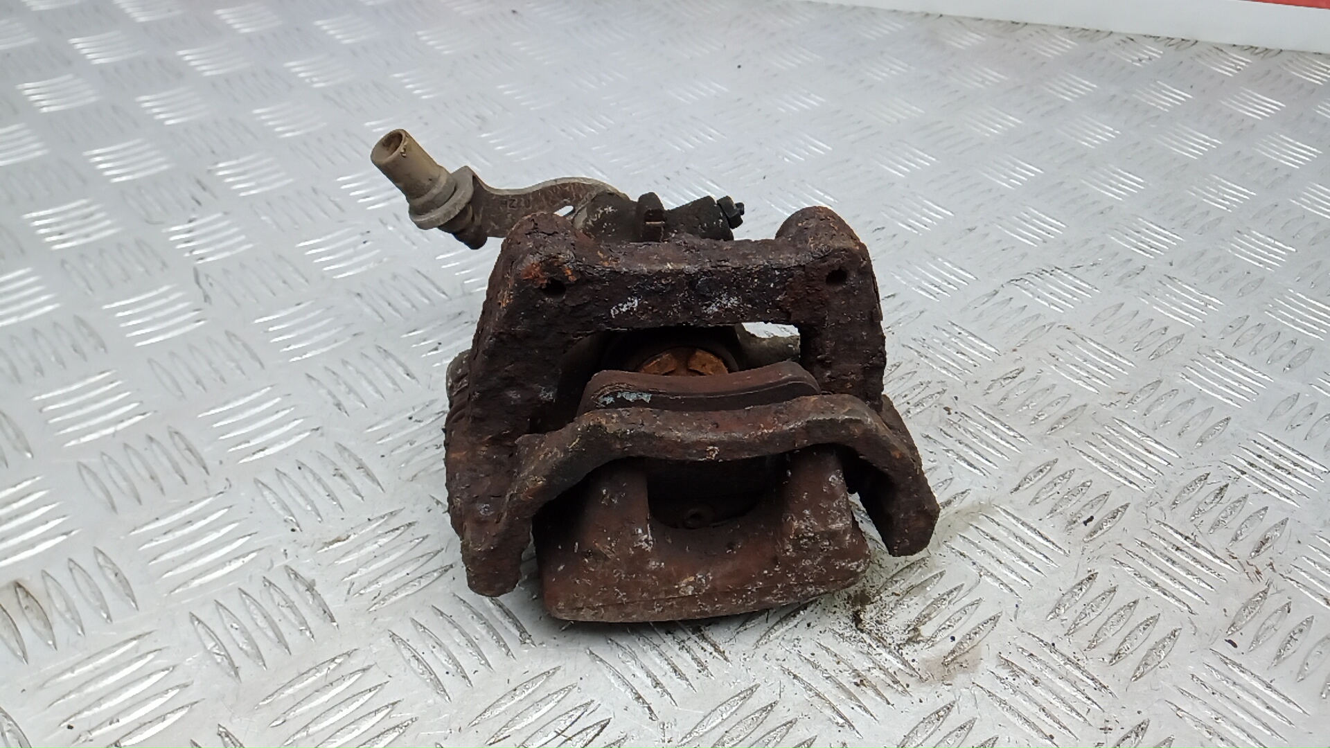 Суппорт задний левый