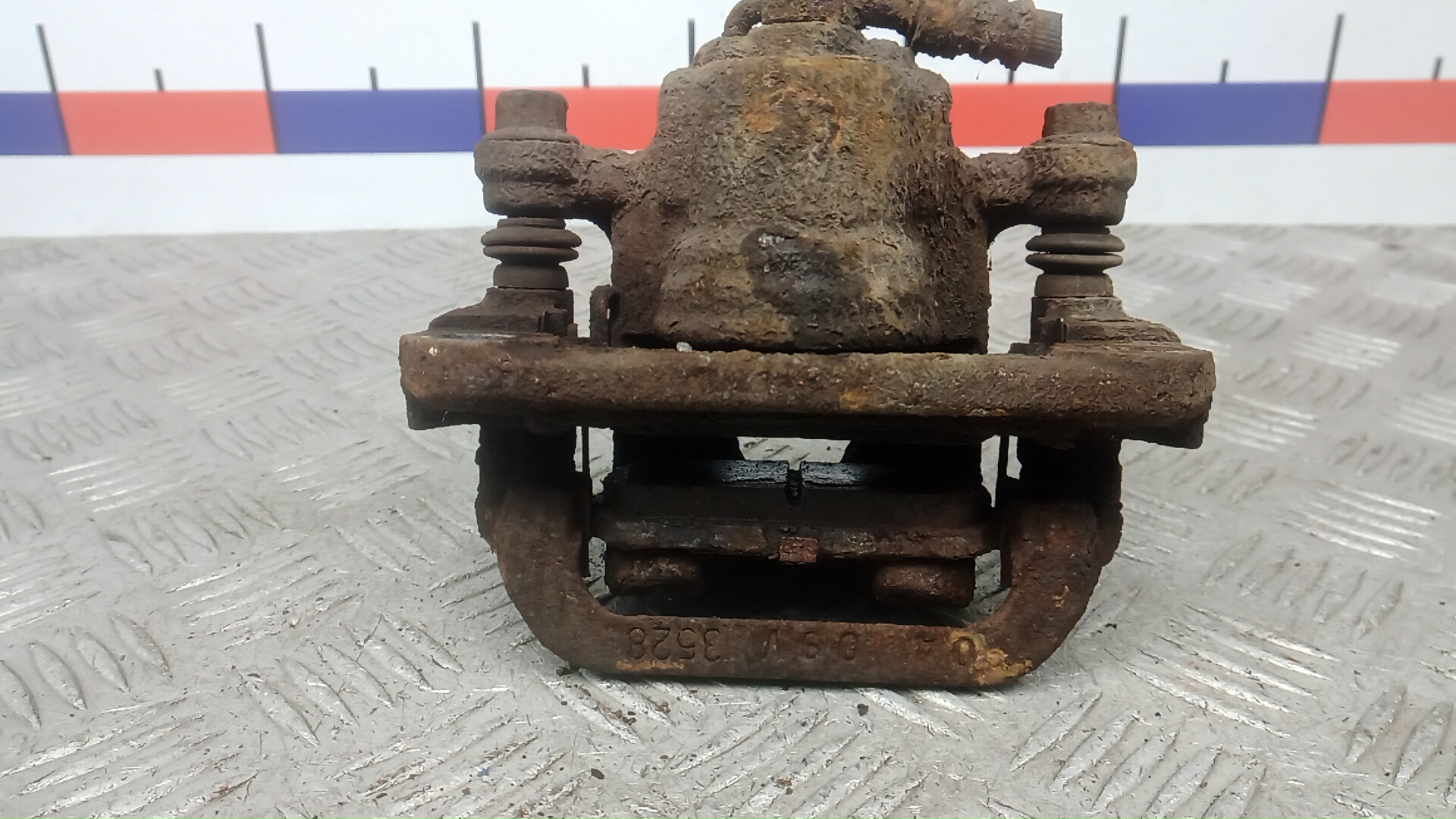 Суппорт задний левый