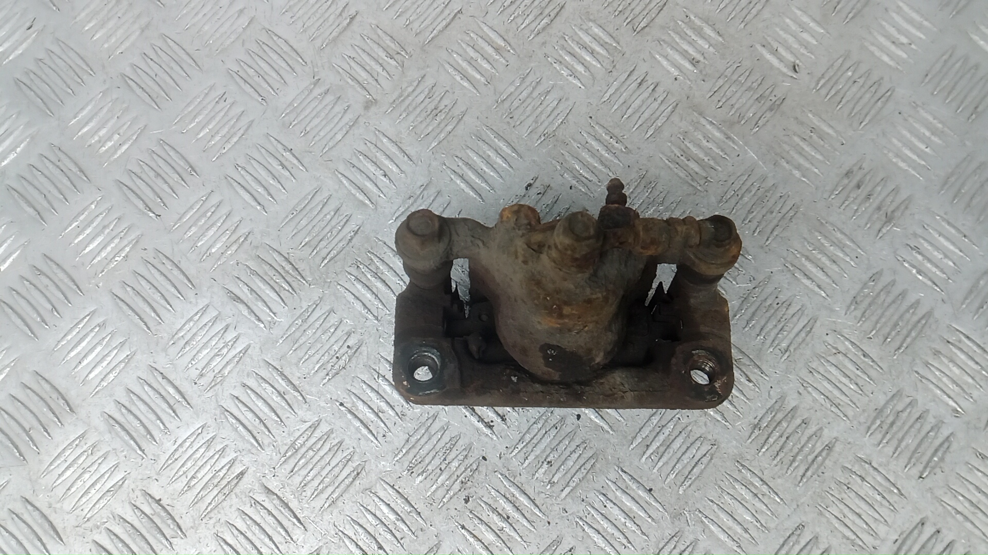 Суппорт задний левый