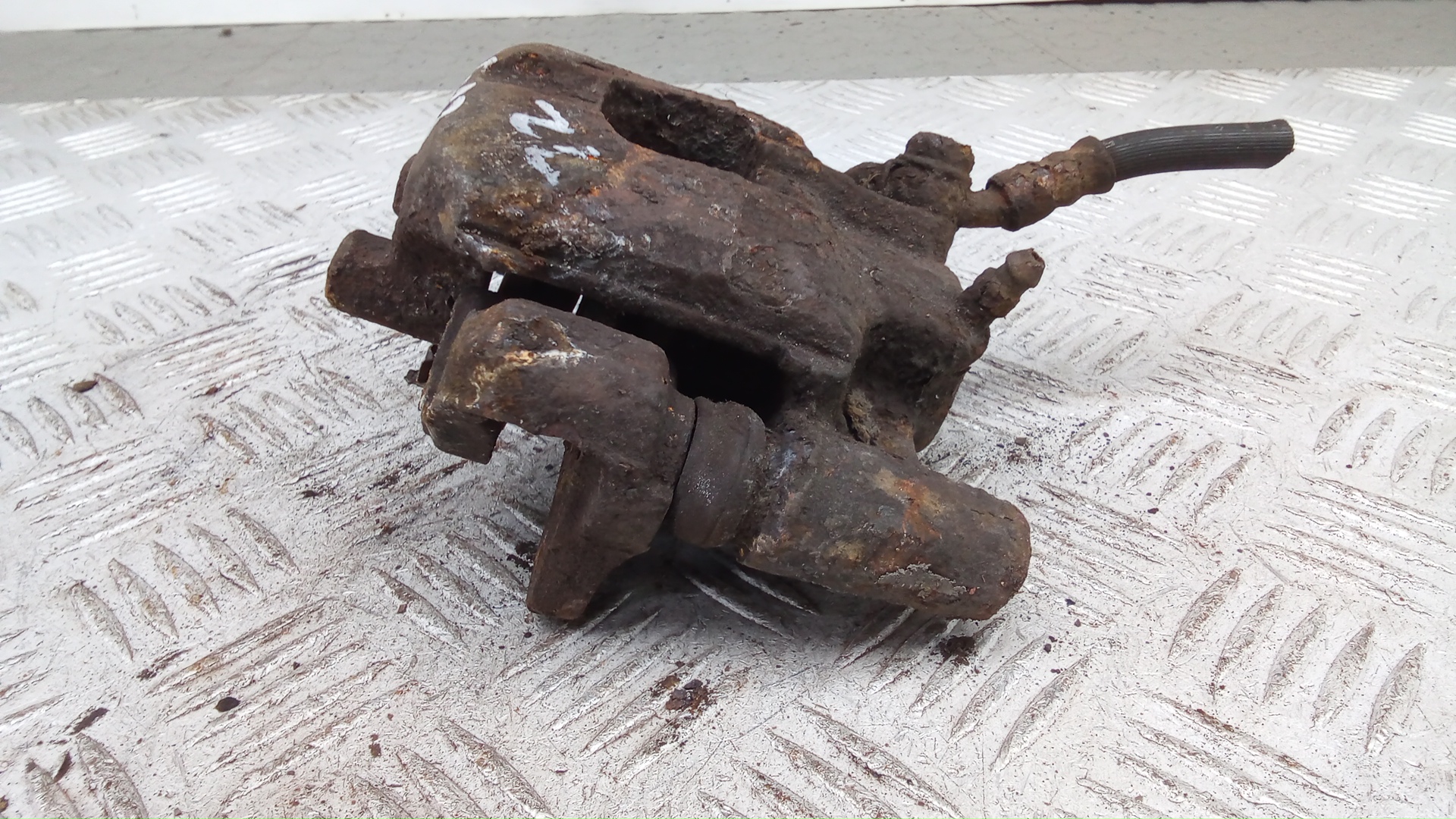 Суппорт задний левый