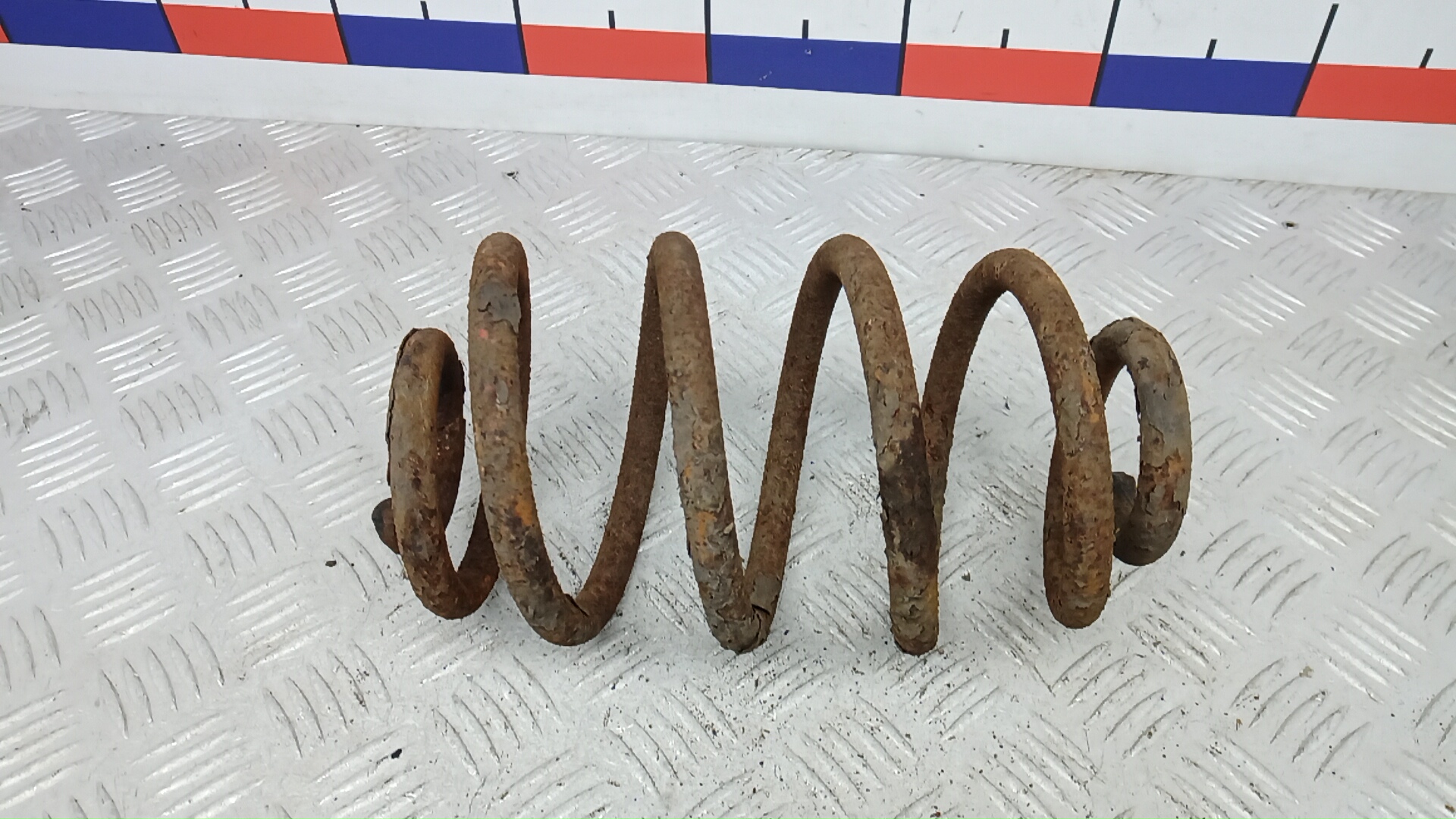 Пружина задняя