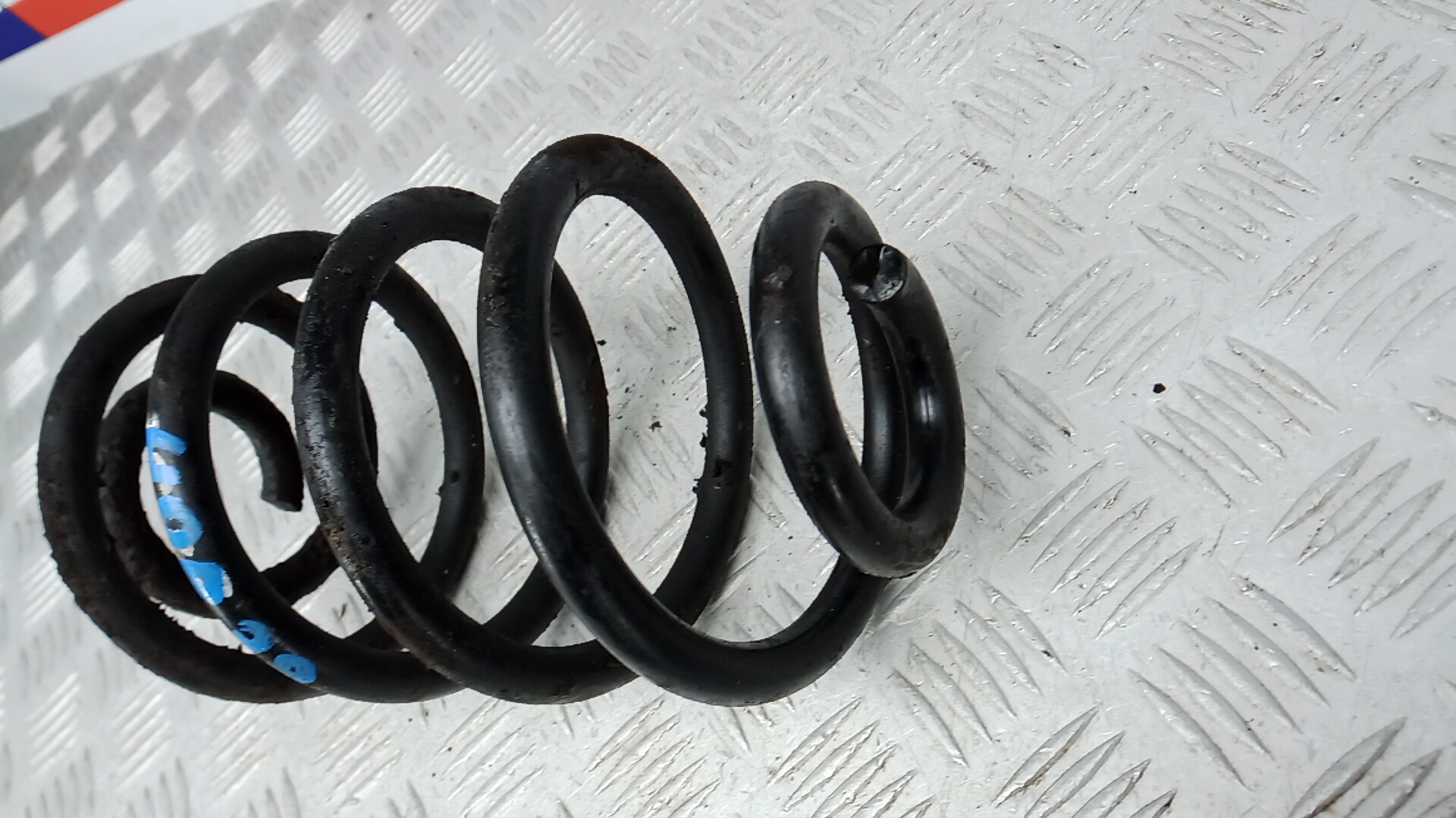 Пружина задняя