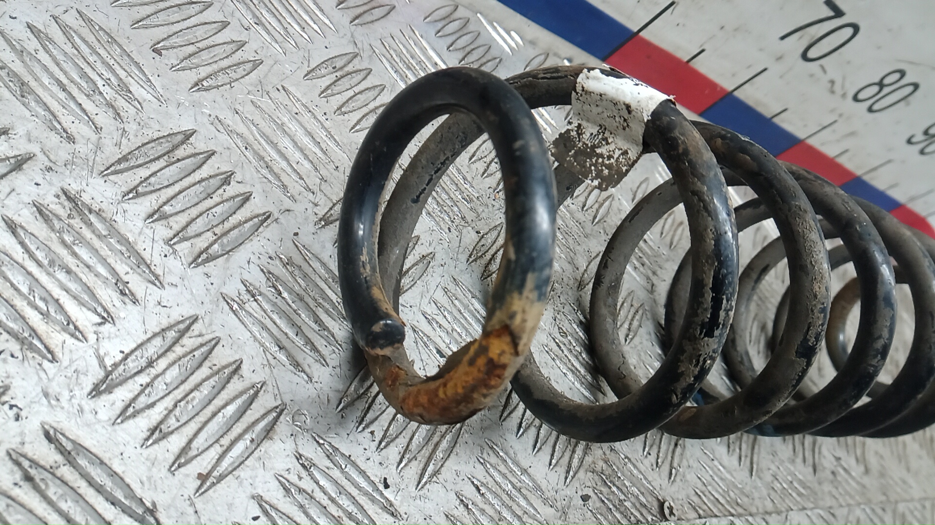 Пружина задняя