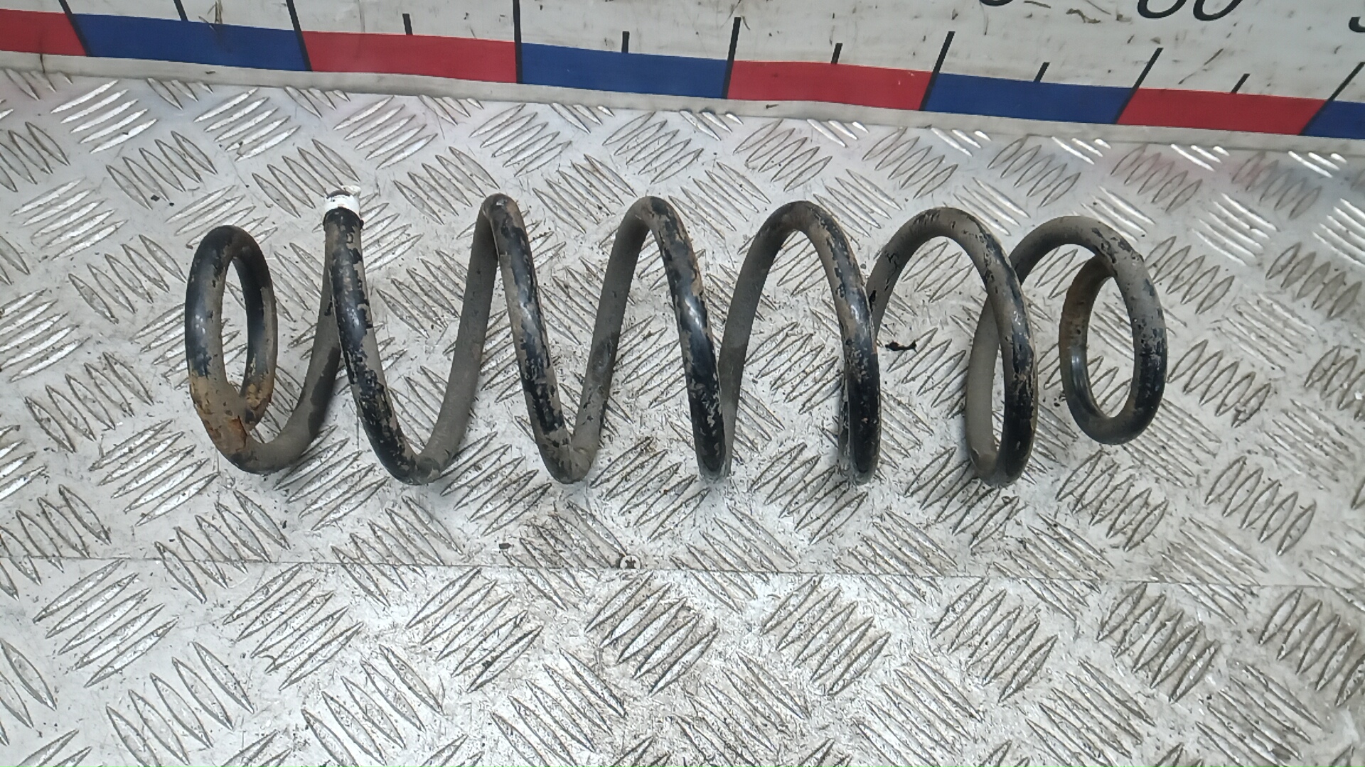 Пружина задняя