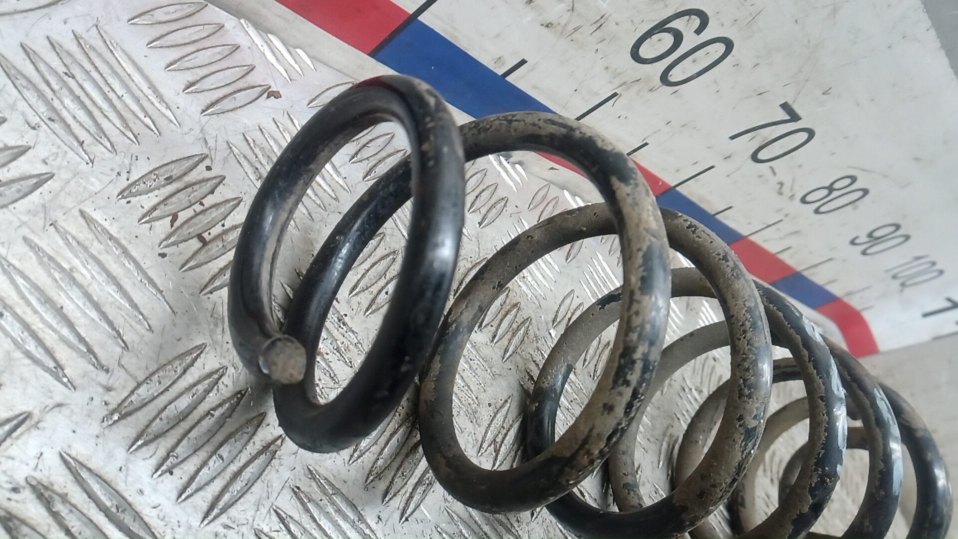 Пружина задняя