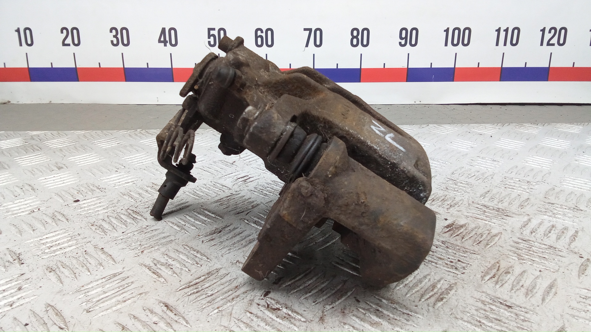 Суппорт задний левый