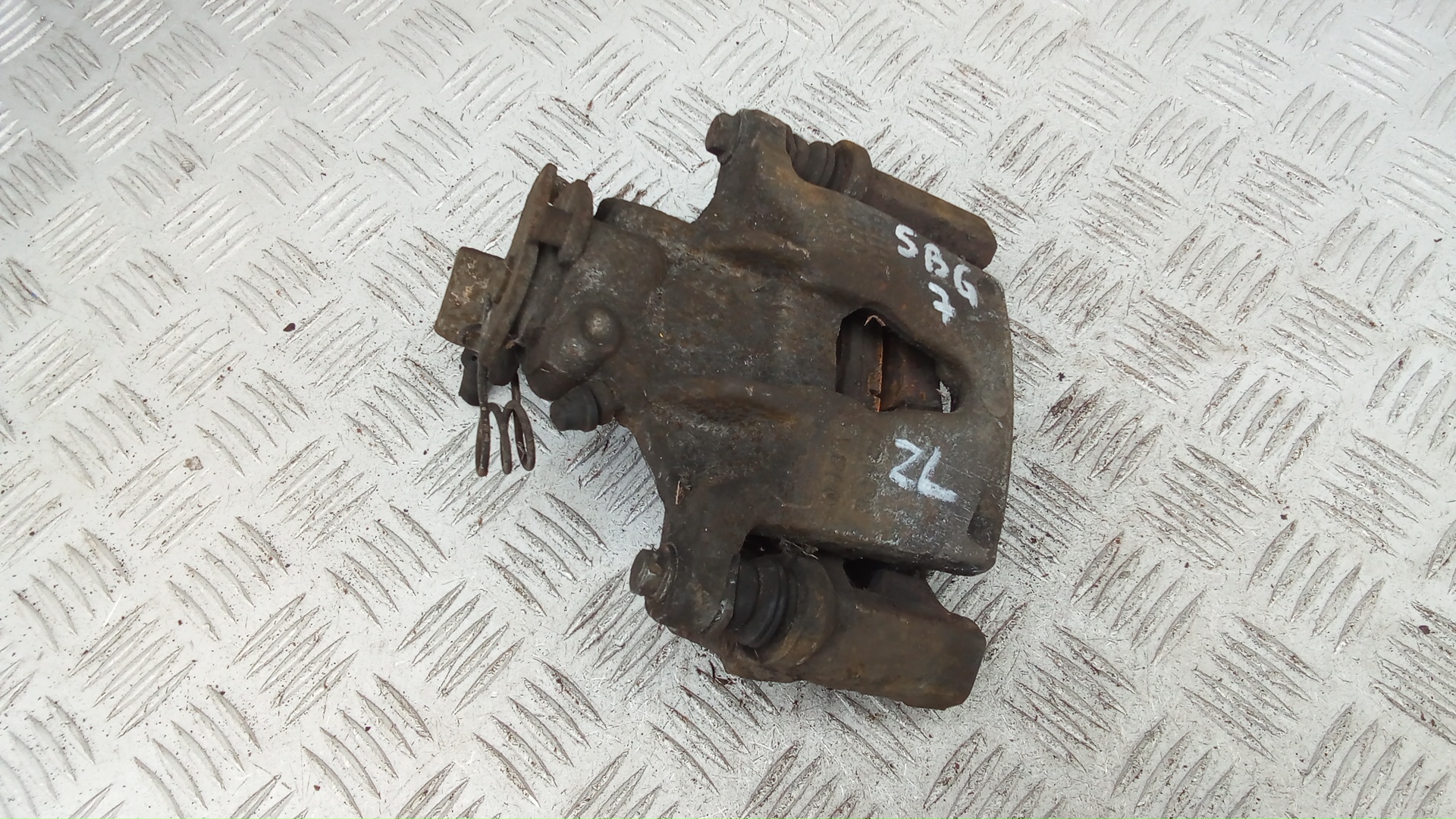 Суппорт задний левый