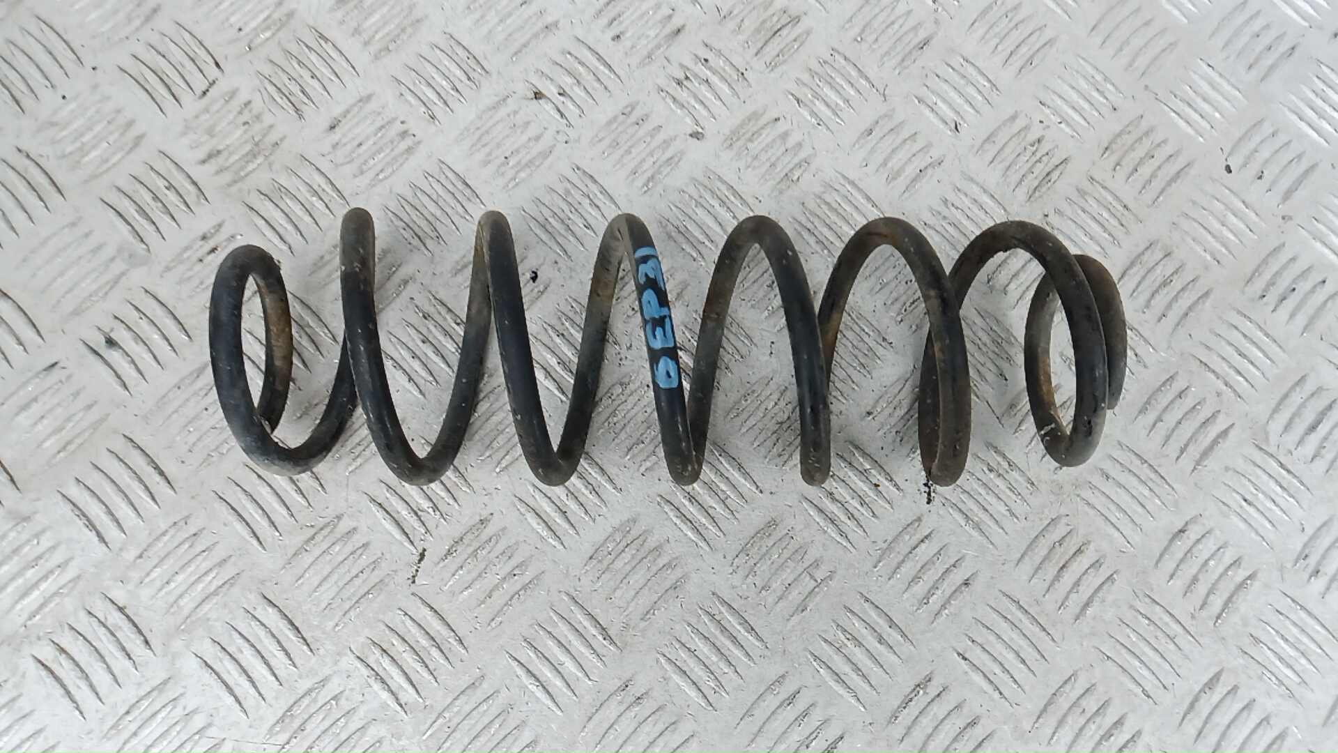 Пружина задняя