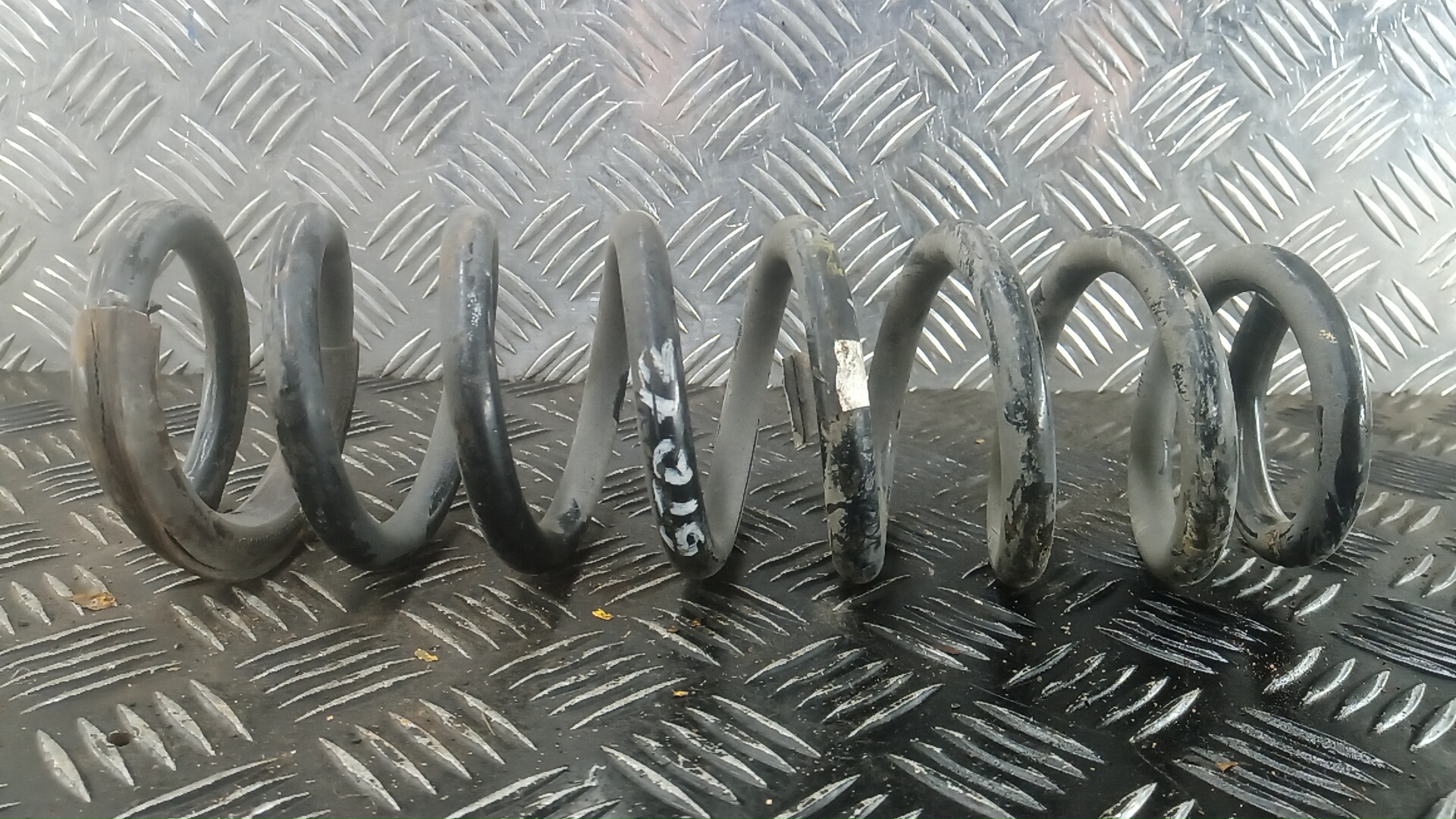 Пружина задняя