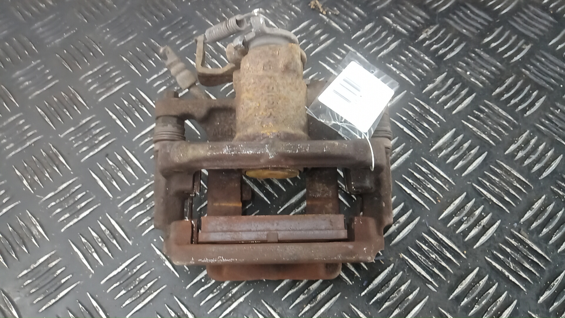 Суппорт задний левый