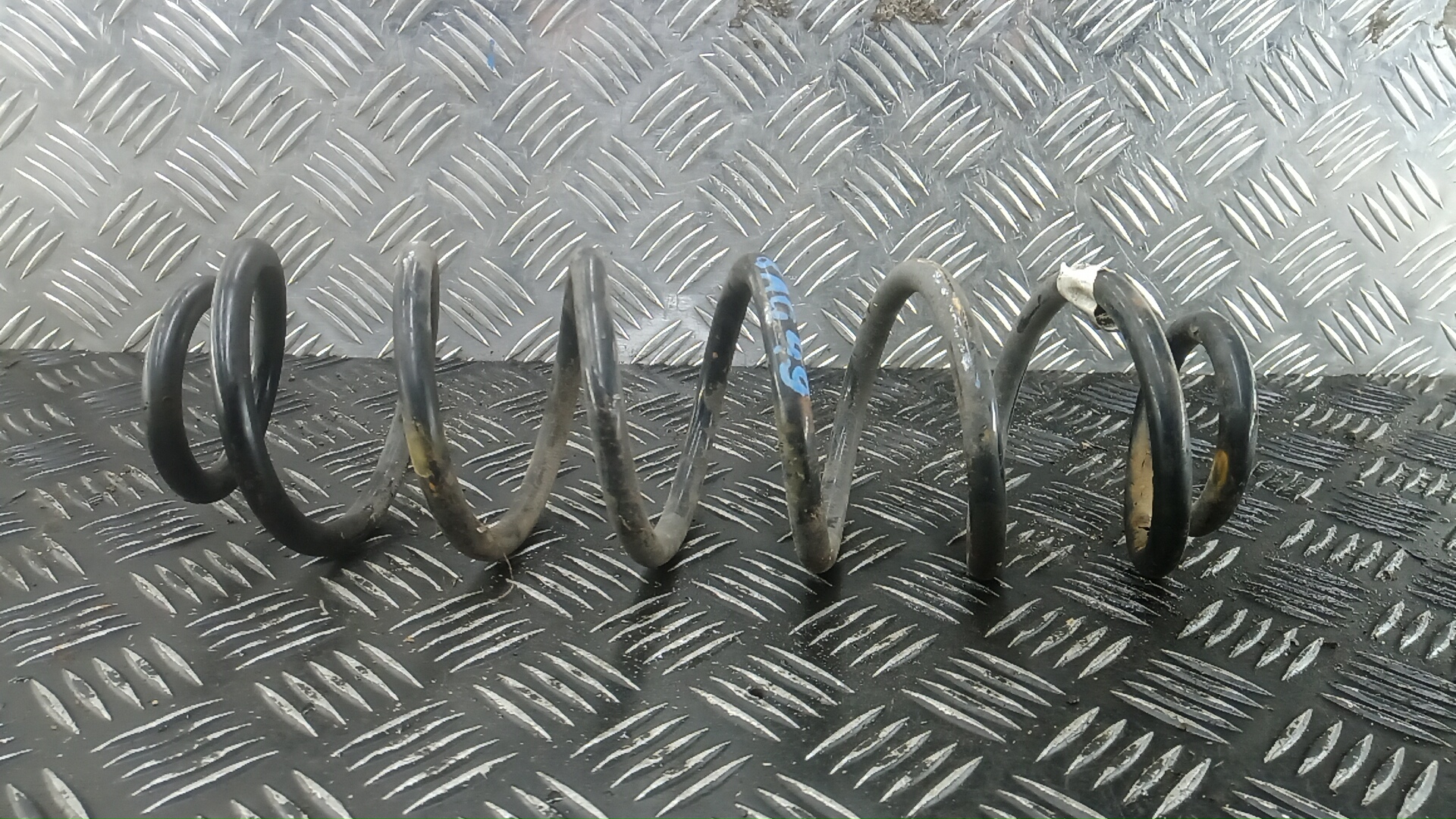 Пружина задняя