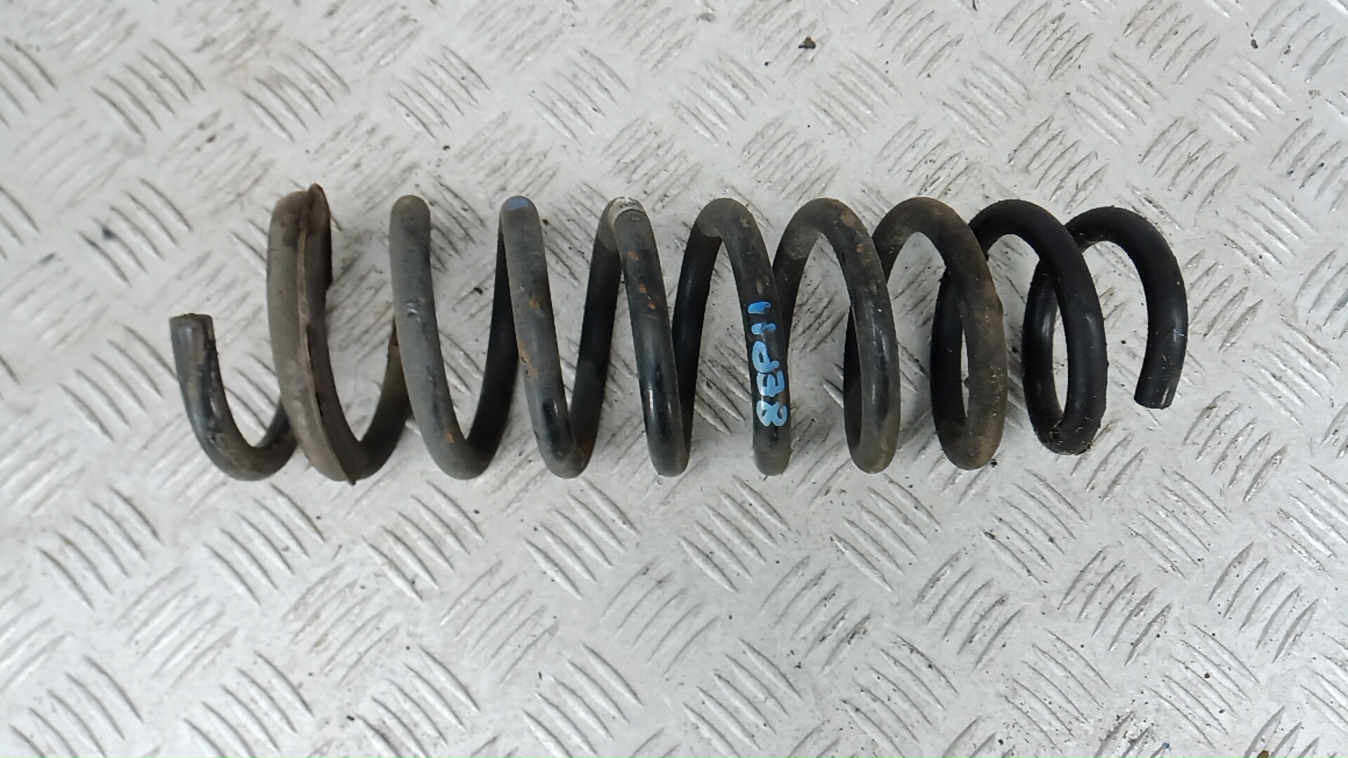 Пружина задняя