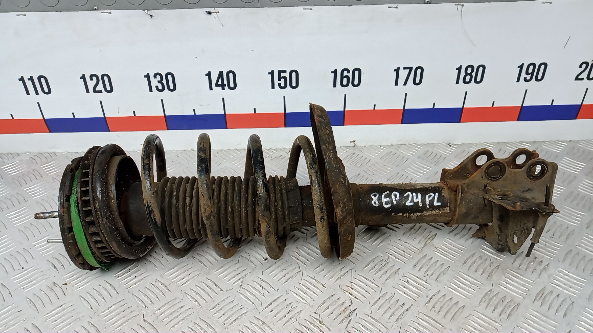 Амортизатор передний левый