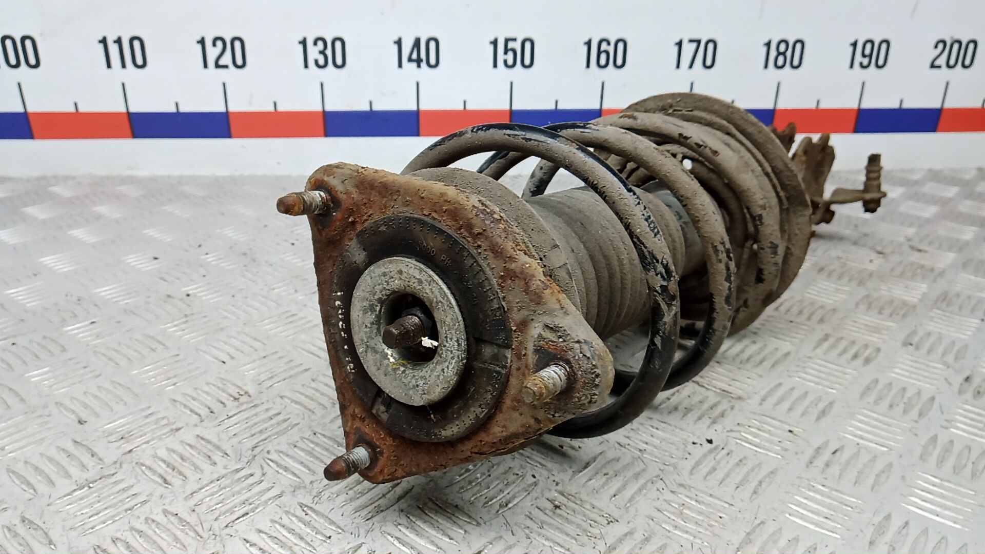 Амортизатор передний левый