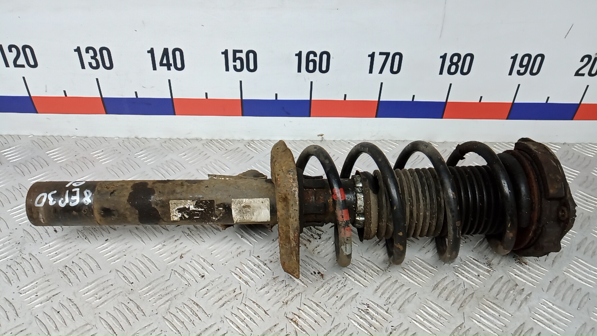 Амортизатор передний левый