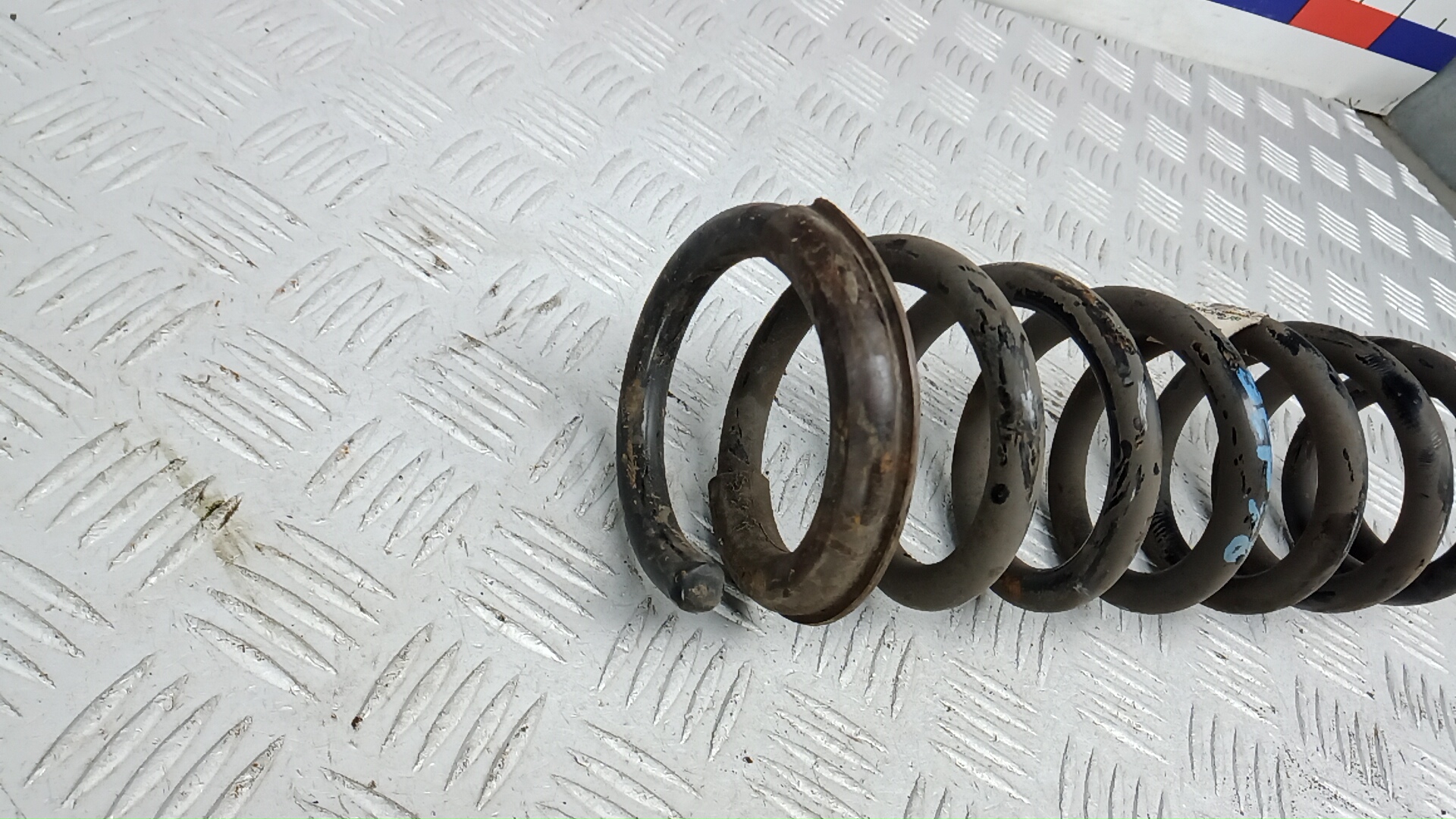 Пружина задняя