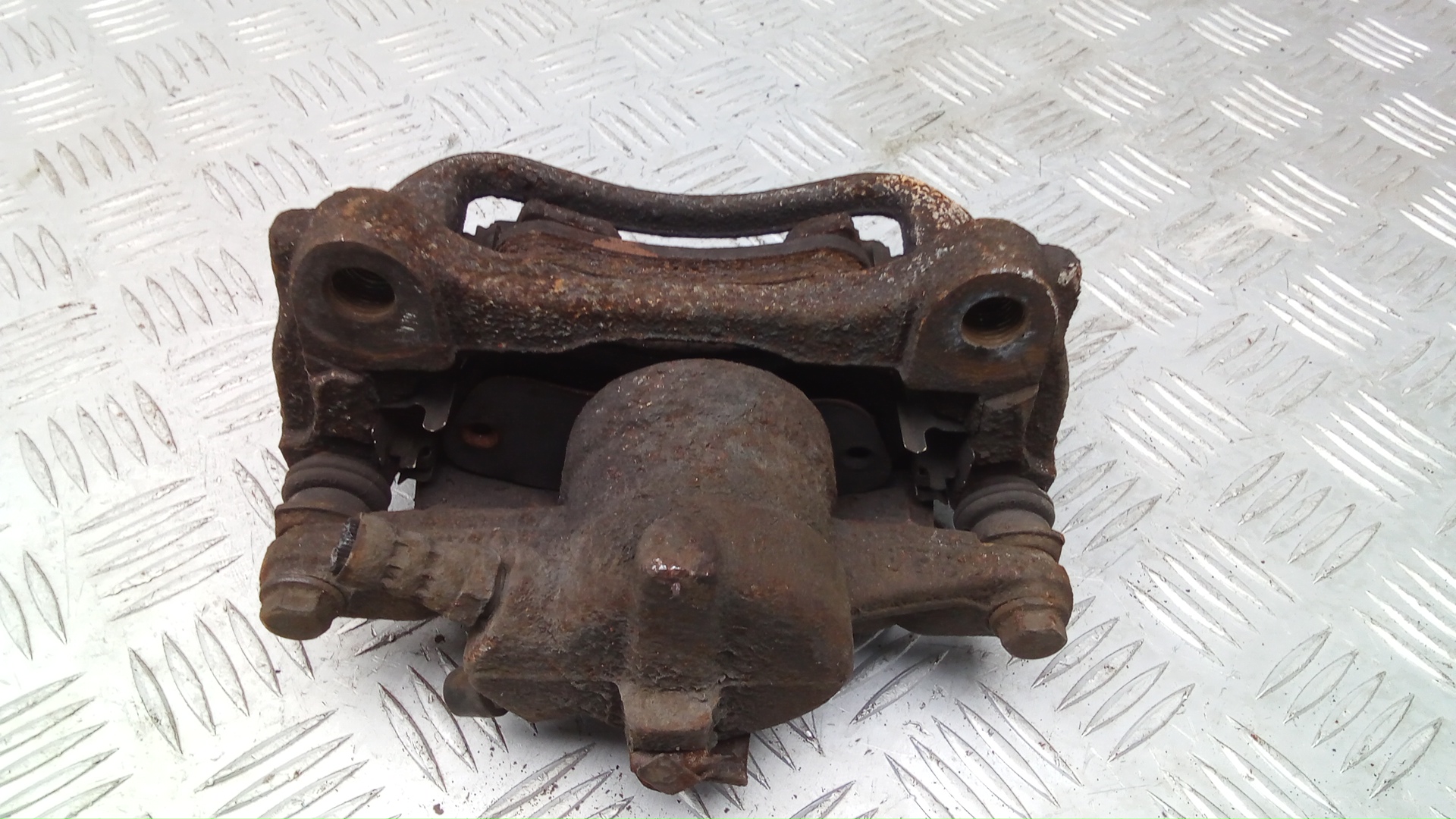 Суппорт задний левый