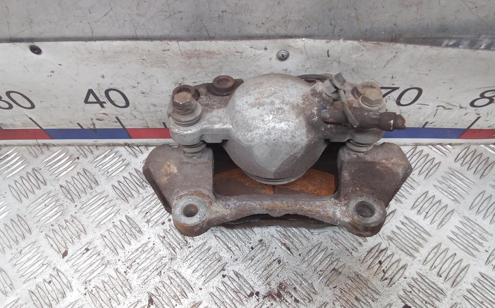 Суппорт передний левый