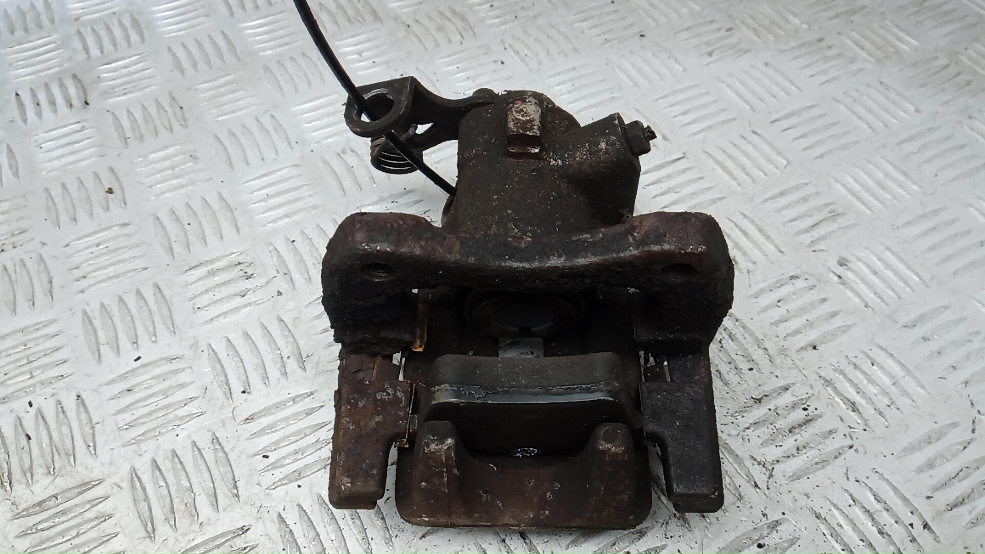 Суппорт задний левый