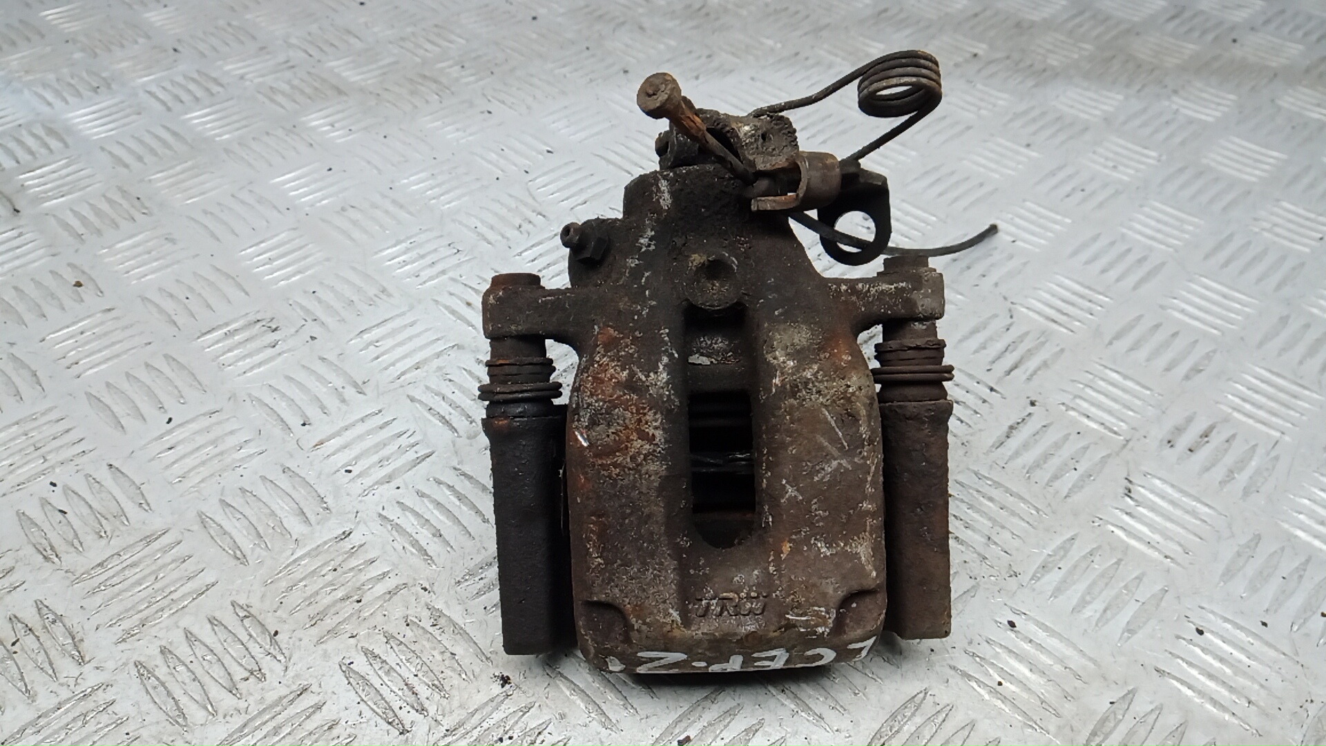 Суппорт задний левый