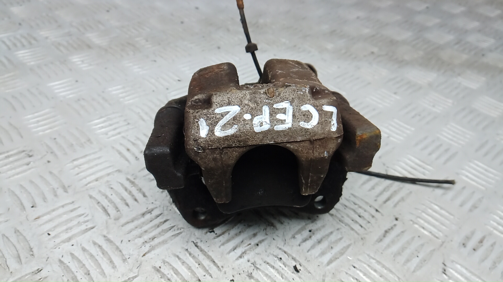 Суппорт задний левый