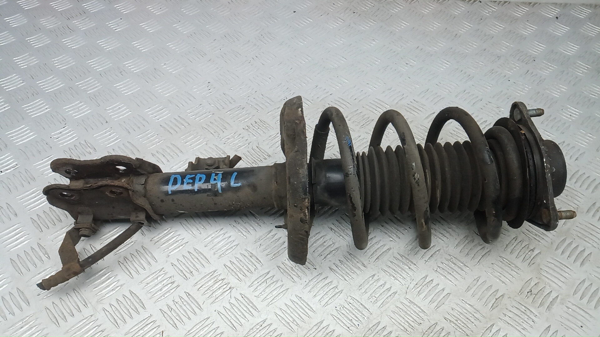 Амортизатор передний левый