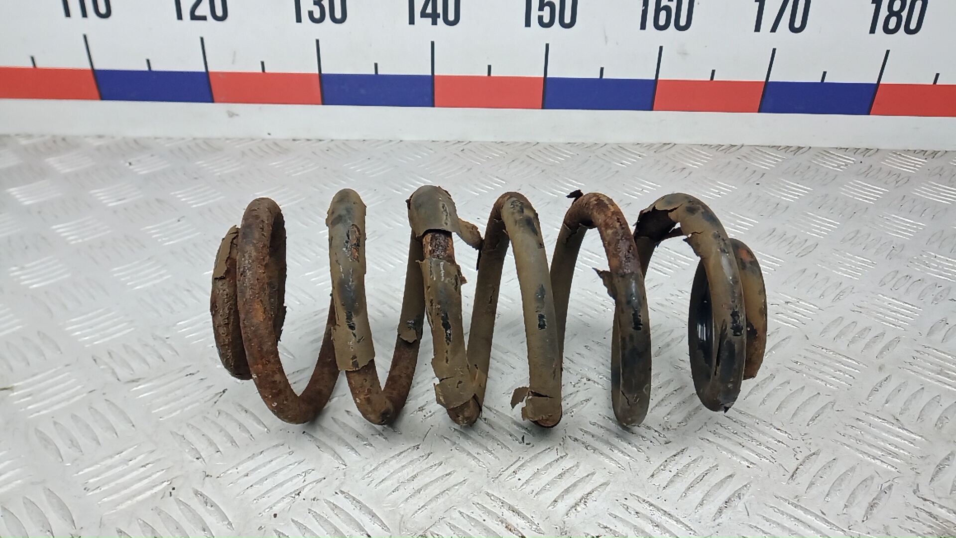 Пружина задняя