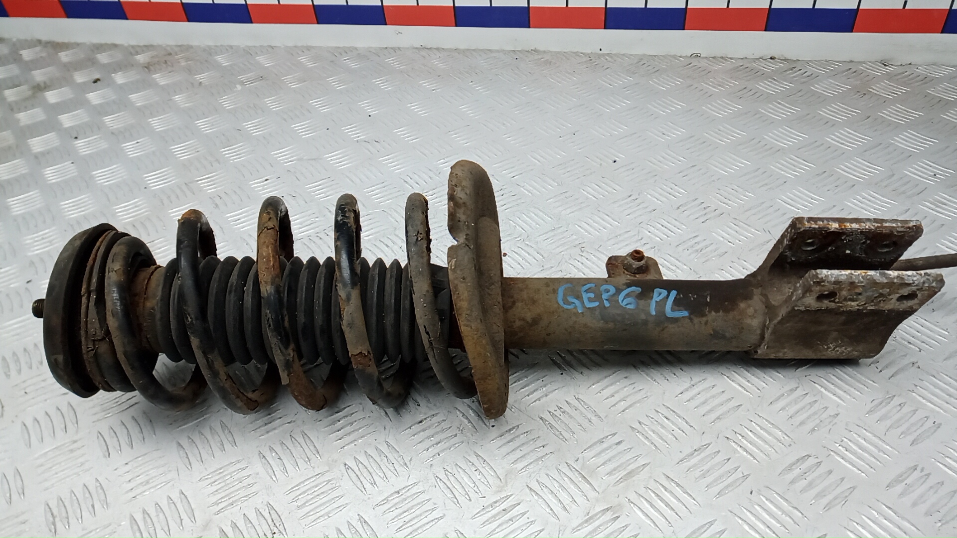 Амортизатор передний левый