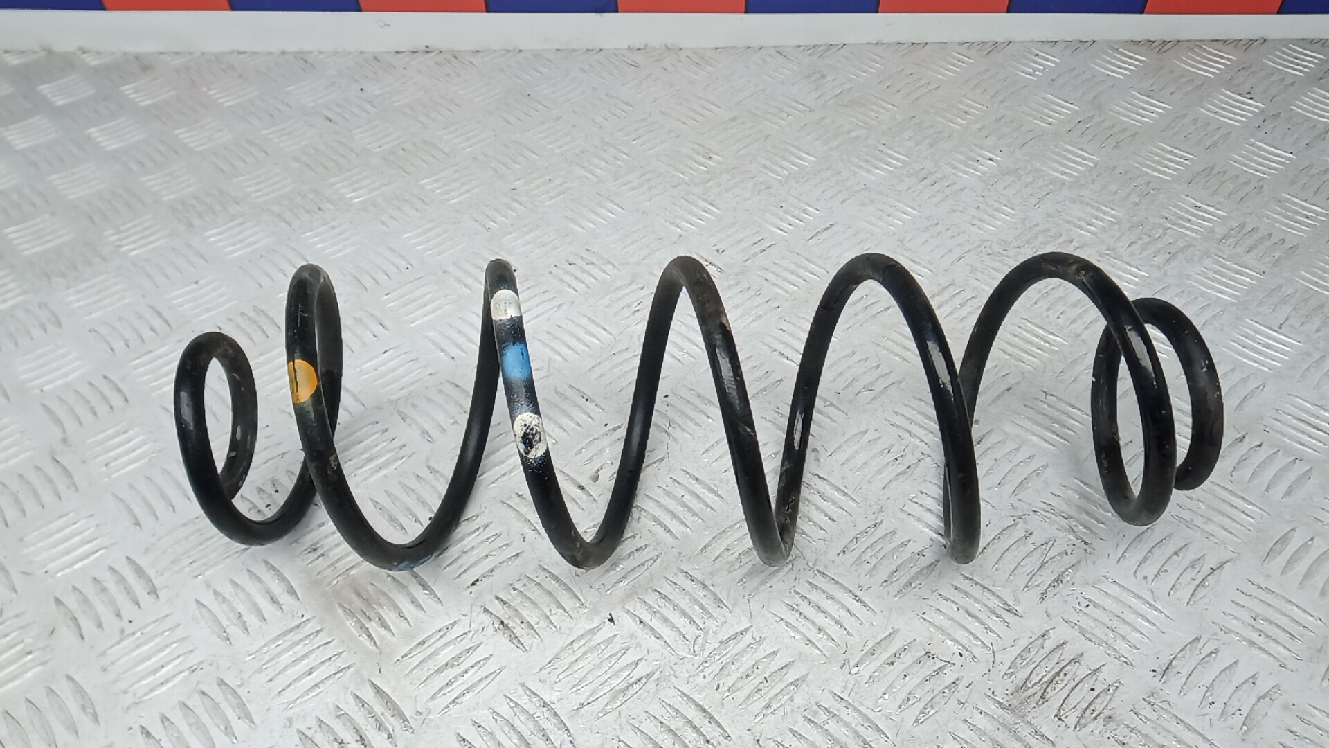 Пружина задняя