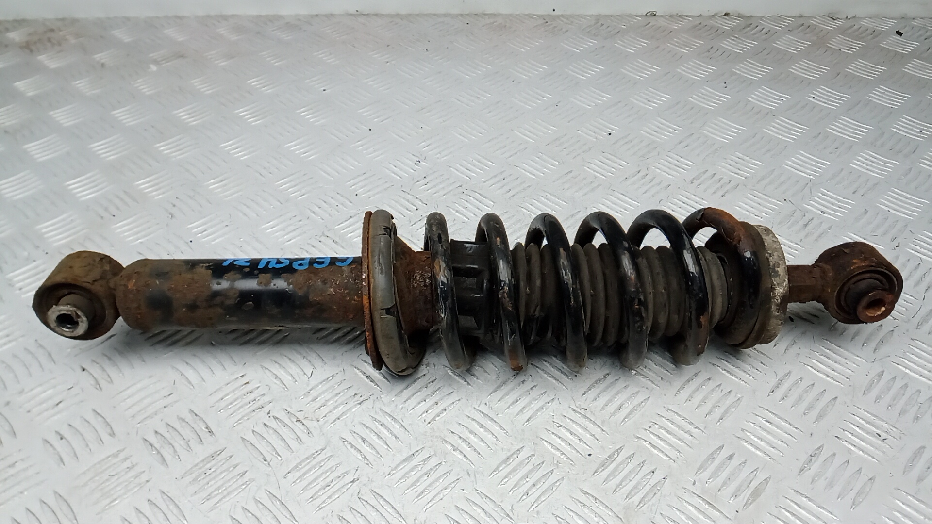 Амортизатор задний левый