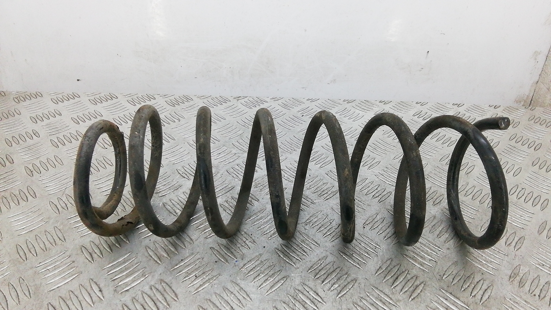 Пружина задняя