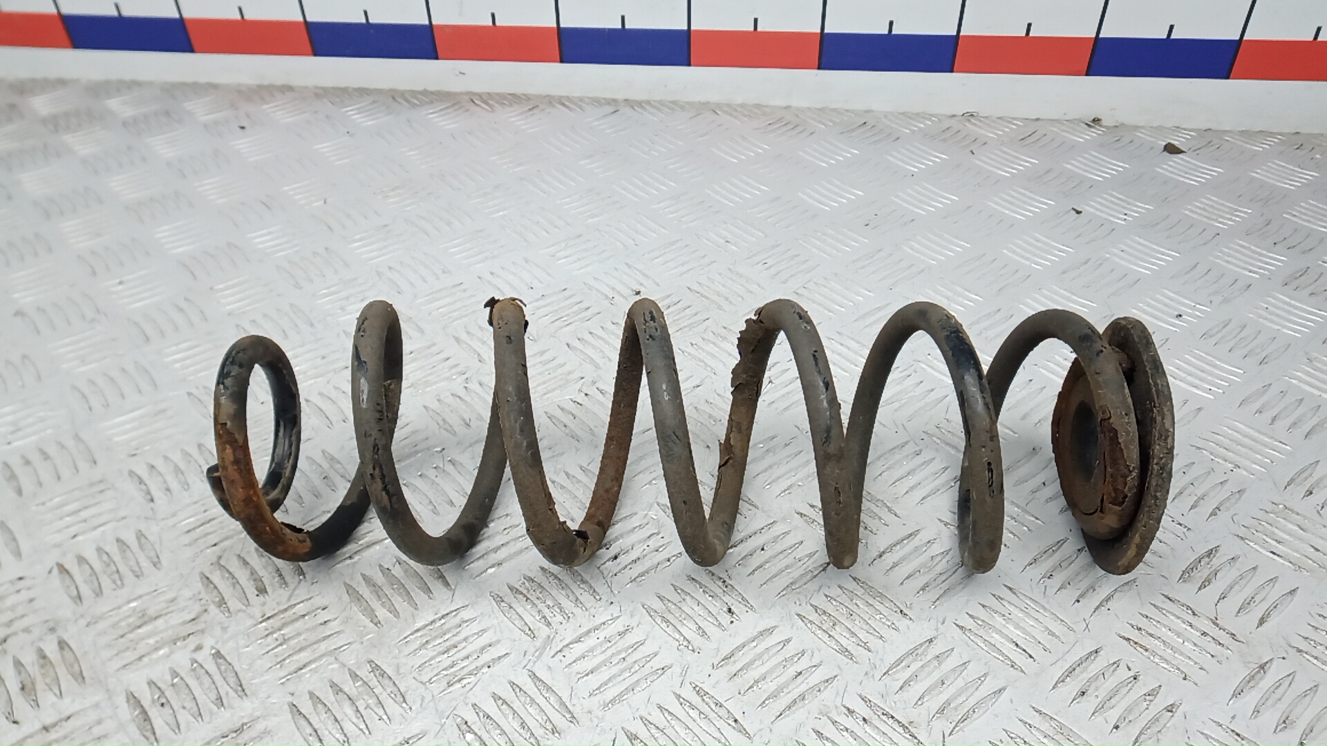 Пружина задняя