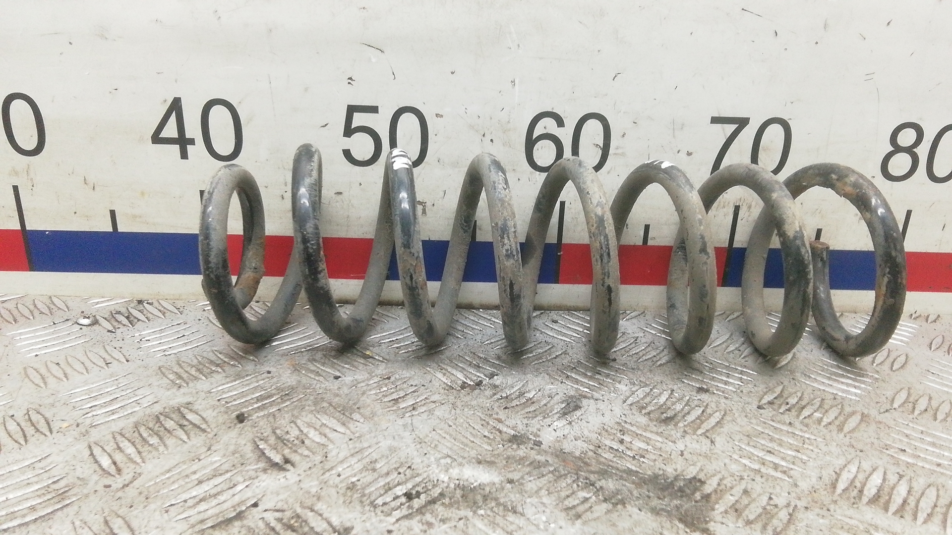 Пружина задняя