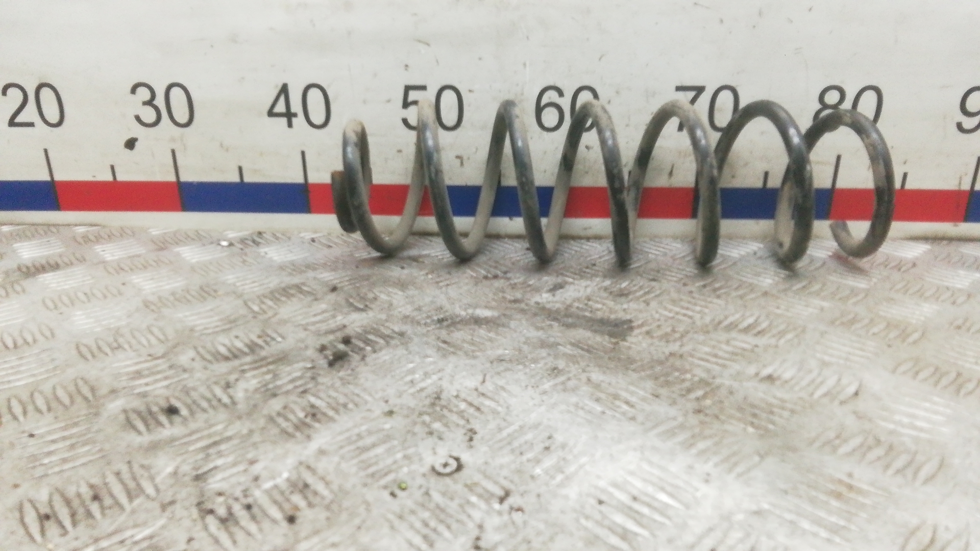 Пружина задняя