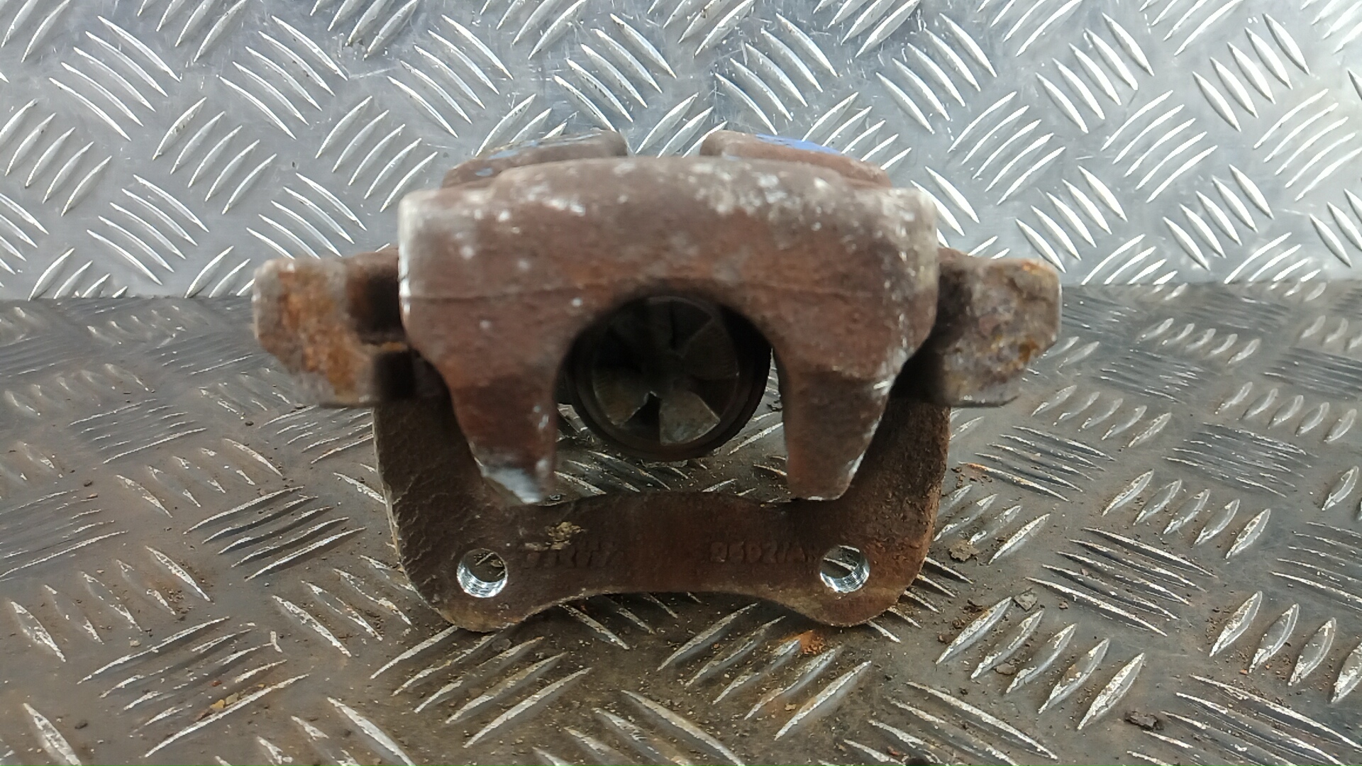 Суппорт задний левый