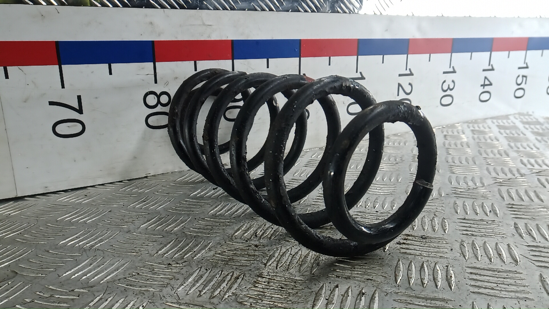Пружина задняя