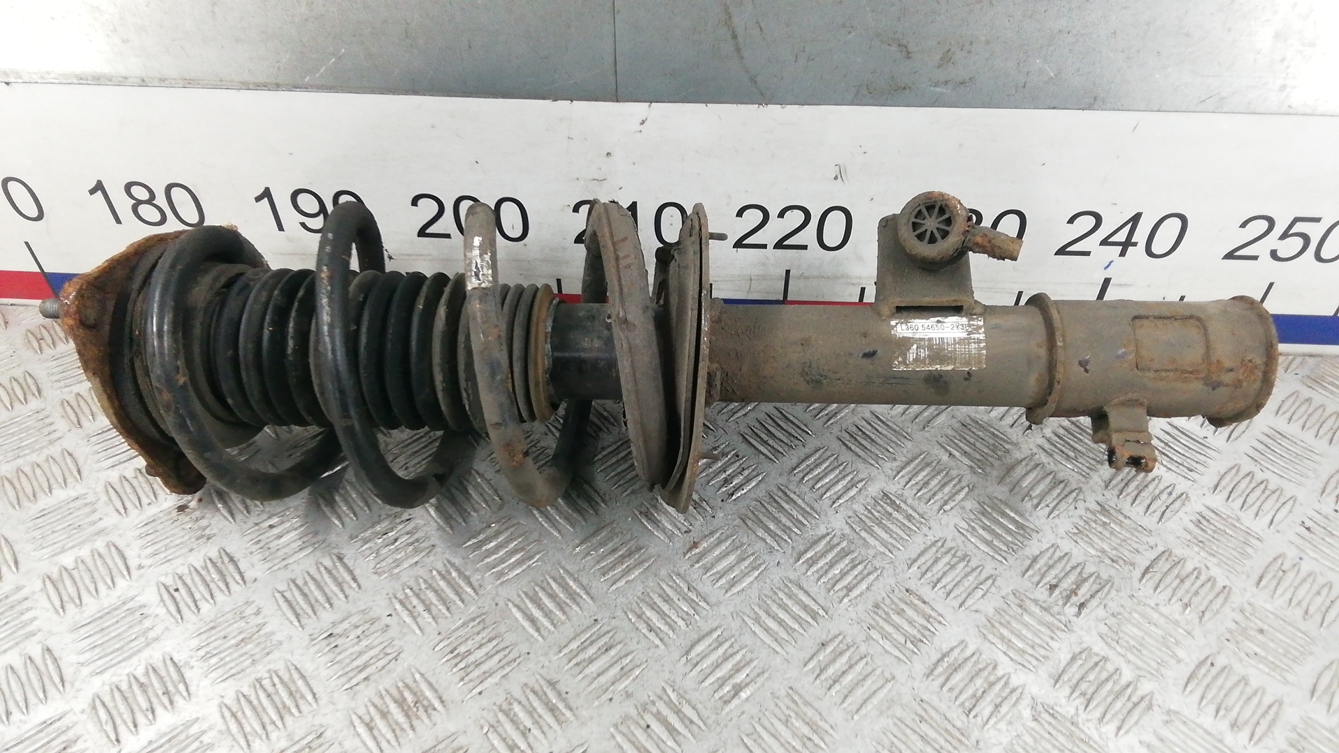 Амортизатор передний левый