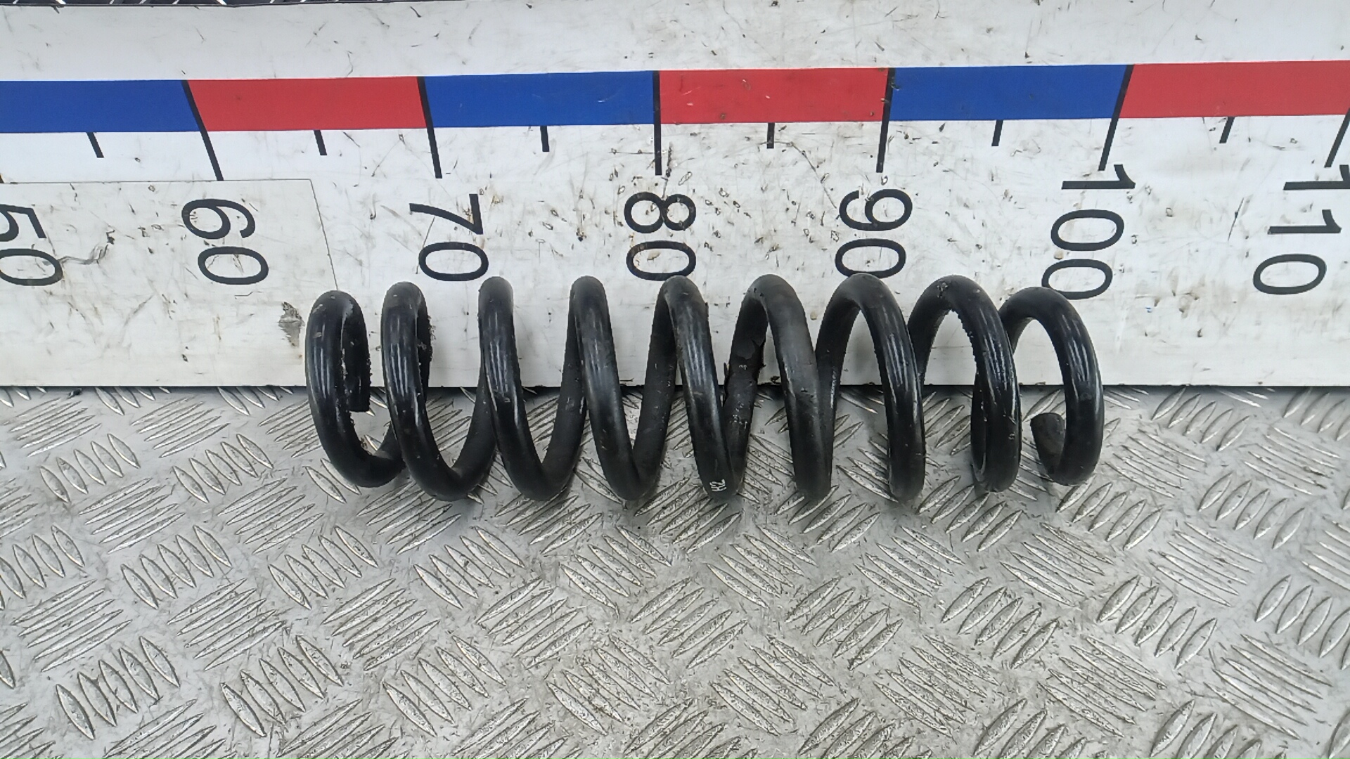 Пружина задняя