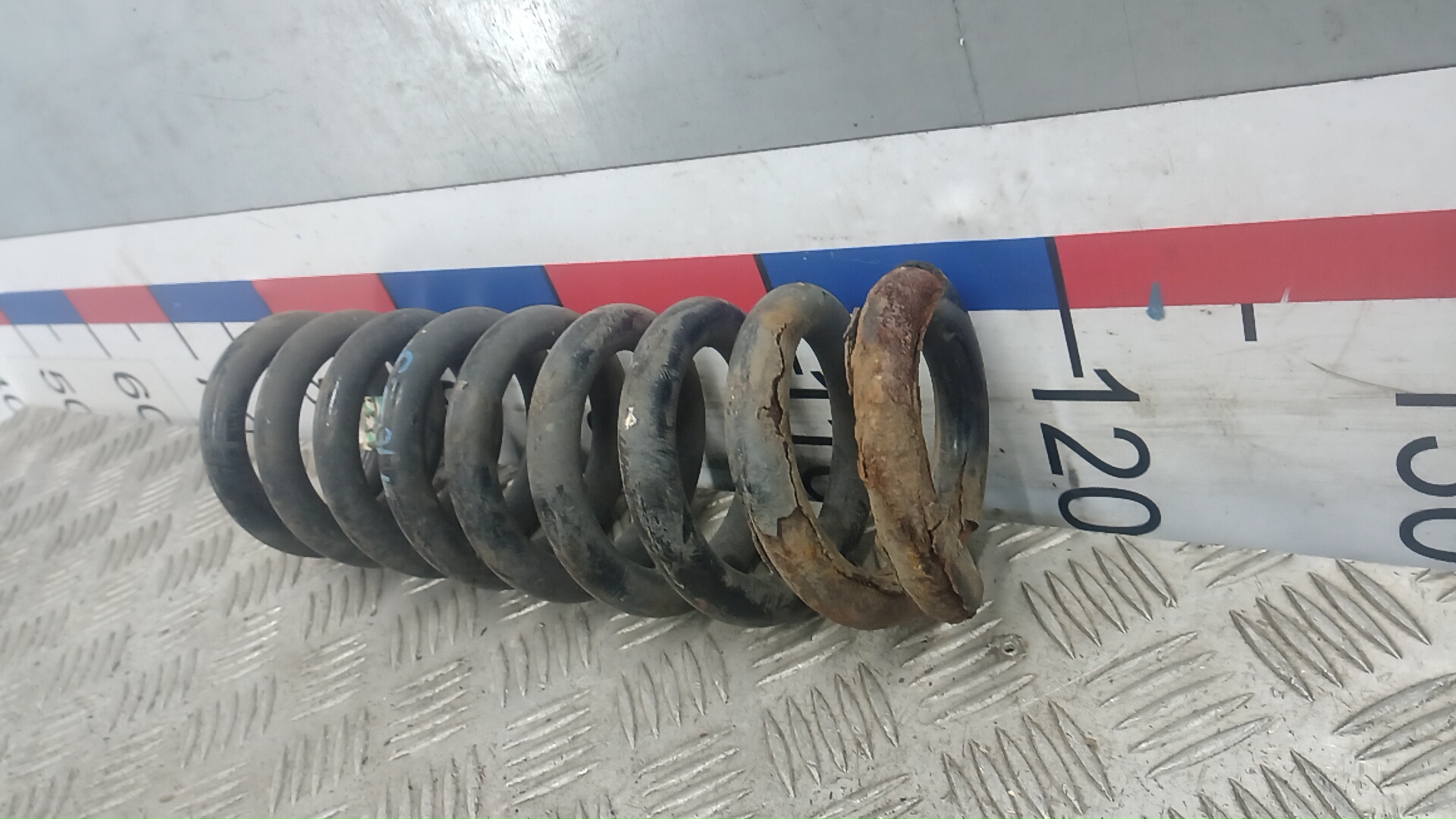 Пружина задняя