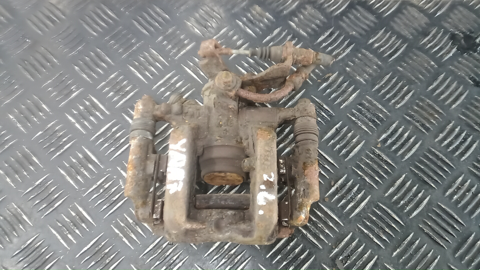 Суппорт задний левый