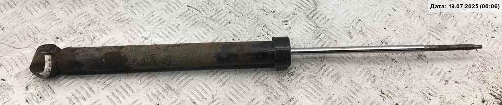 Амортизатор задний левый