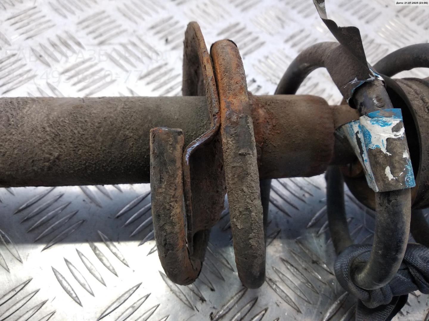 Амортизатор задний левый