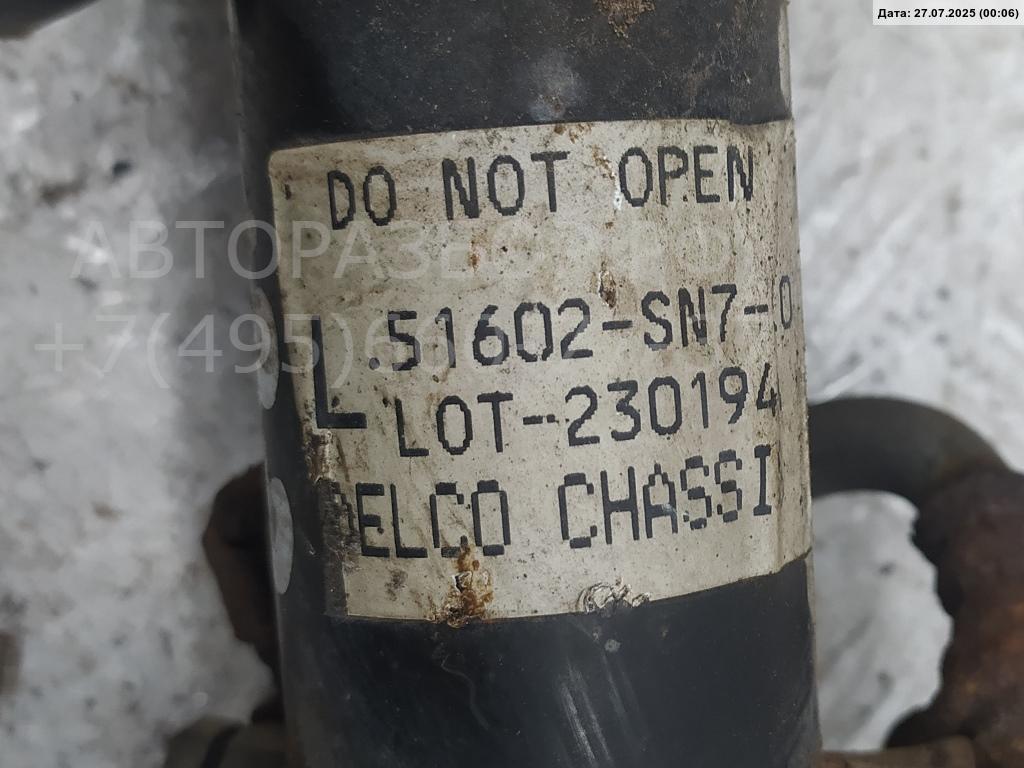 Амортизатор передний левый