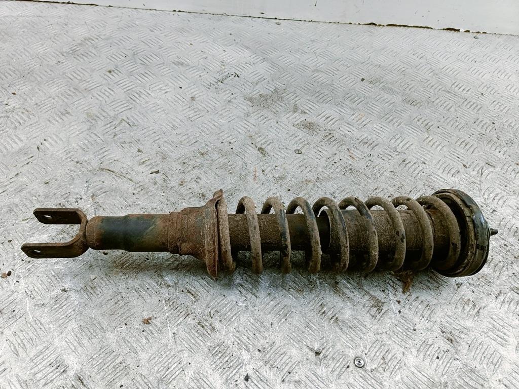 Амортизатор задний левый