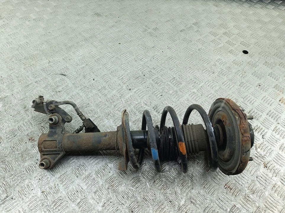 Амортизатор передний левый